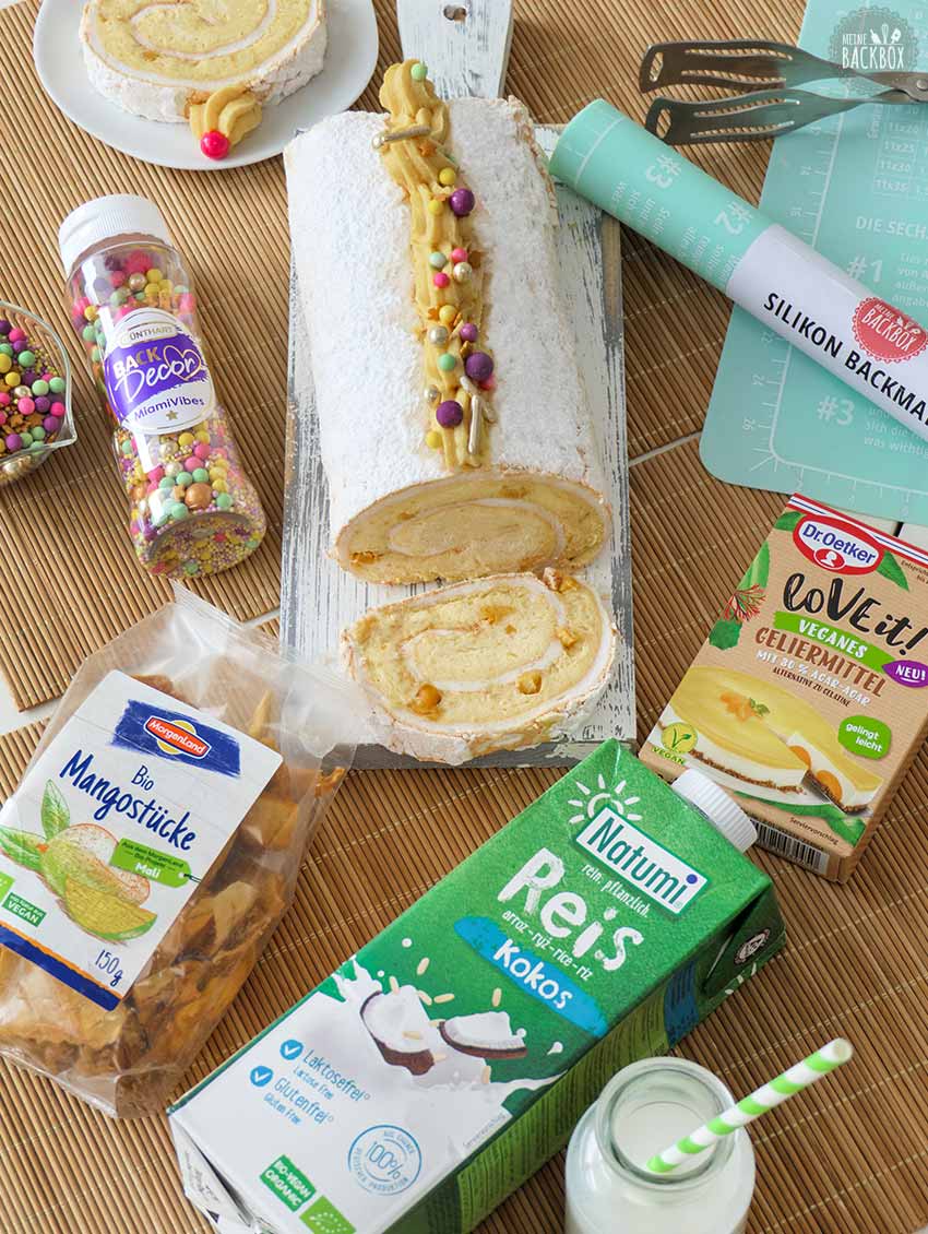 Geeiste Mango-Baiserrolle mit den Produkten aus der Box